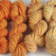 Marigold: orange, hand dyed, bulky rug weight, 100% wool yarn in 6 color values for fine shading for rug hooking and punching.