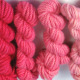 Bulky - Poppy. Hand dyed, bulky rug weight, 100% wool yarn in a pack of 6 red gradated color values. 3-ply, approx 260 yds per lb.