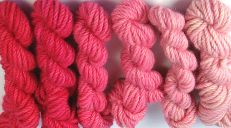 Bulky - Poppy. Hand dyed, bulky rug weight, 100% wool yarn in a pack of 6 red gradated color values. 3-ply, approx 260 yds per lb.