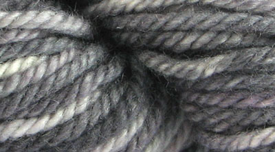 Deer Isle Granite: hand dyed, bulky rug weight, 100% wool spot dyed yarn in a medium gray with flecks of pink and tan colors for rug hooking and punching.
