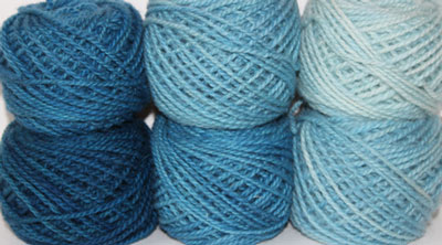 Blueberry: blue, hand dyed, worsted weight, 100% wool yarn in 8 color values for fine shading for rug hooking and punching.